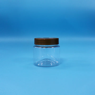 Des biscuits de bonbons transparents en PET, des pots ronds en plastique, des couvercles plats et des vis de qualité alimentaire.