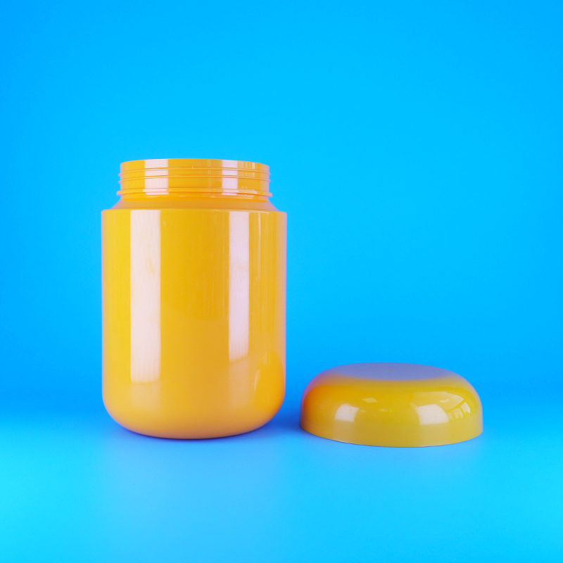 Bocaux à biscuits et bonbons ronds en plastique PET orange de qualité alimentaire avec bouchon plat à vis orange