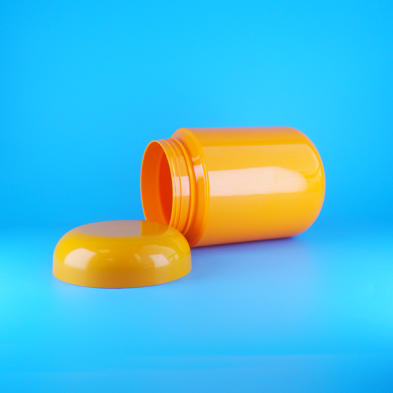 Bocaux à biscuits et bonbons ronds en plastique PET orange de qualité alimentaire avec bouchon plat à vis orange
